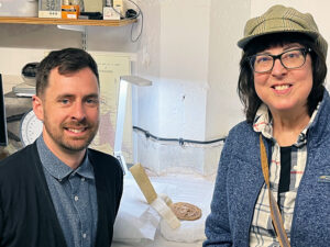 Susan Troxell poses with Yorkshire Museum curator Adam Parker and the Tyrell Grant